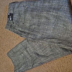 Black and gray with sparkle. Brand new with tags.